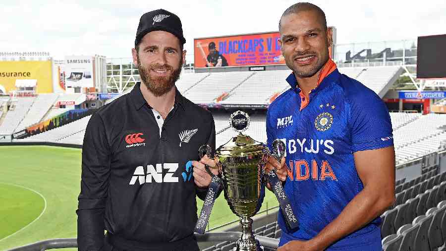 India captain Shikhar Dhawan (right) and New Zealand skipper Kane Williamson with the ODI series trophy at Eden Park, Auckland, on Thursday