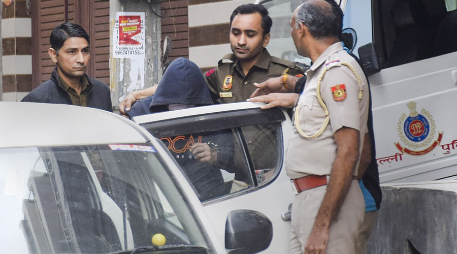 Aftab Ameen Poonawala, accused of killing his partner Shraddha Walkar, being brought to his residence at Chhatarpur as part of the ongoing investigation, in New Delhi.