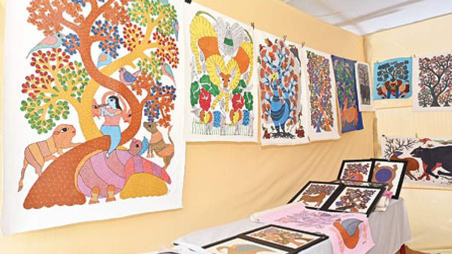 Paintings by Gond tribal artists of Madhya Pradesh on display at one of the numerous handicraft stalls showcasing the art and craftsmanship of tribal men and women