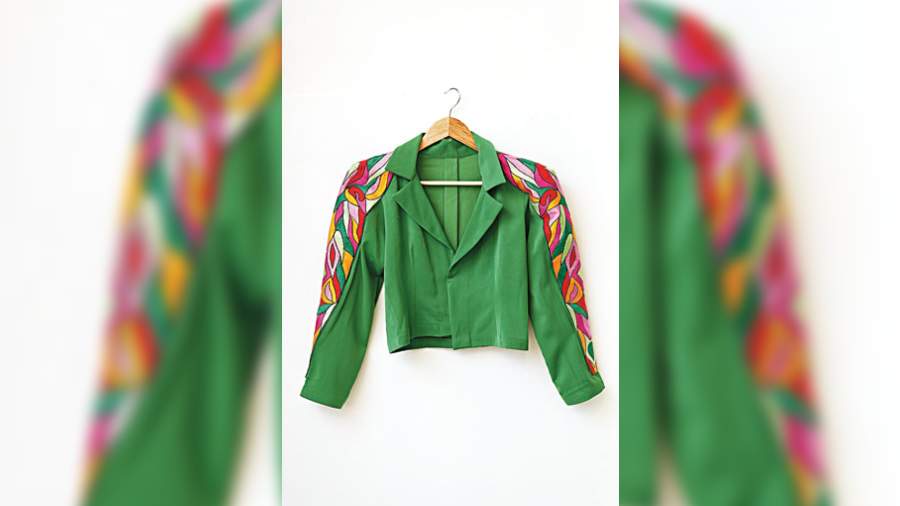 Rock the power shoulders on this beautiful jacket. Subtle yet designed with colourful and detailed embroidery, this is a versatile item to have in your closet.