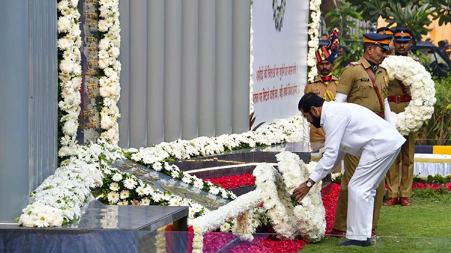 Maharashtra Chief Minister Eknath Shinde pays homage at the Police Memorial on the occasion of the 14th anniversary of the 26/11 Mumbai terror attack, in Mumbai, Saturday, November 26, 2022. 