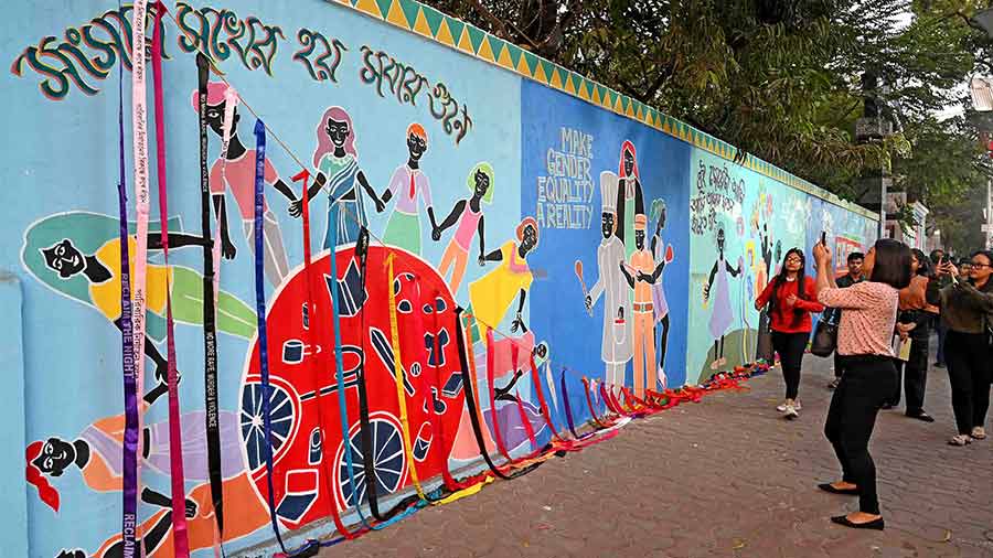 Visitors click photograhs of the wall mural inaugurated by Swayam and Lady Brabourne College, Kolkata