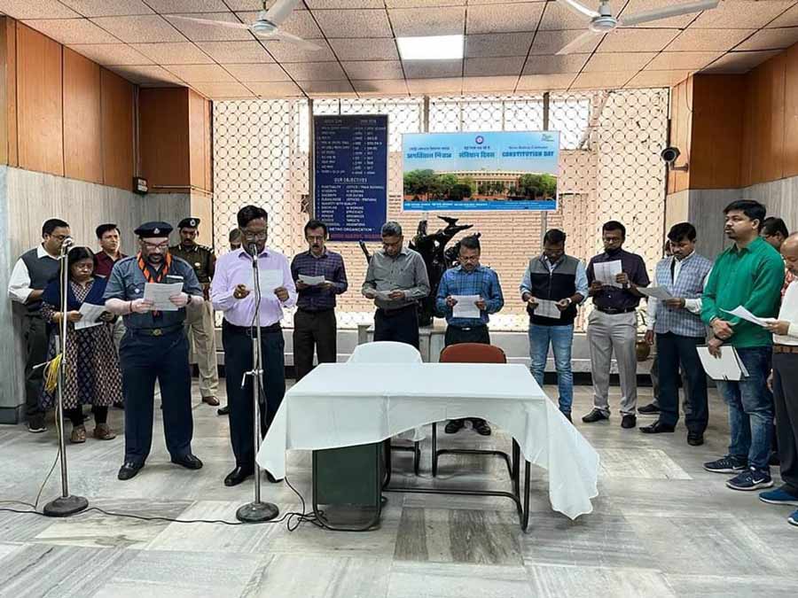 K.K. Patro, principal chief electrical engineer, Metro Railway, reads out the Preamble of the Indian Constitution in the presence of officers and staffers at the Metro Railway Bhavan to mark the Constitution Day on Saturday