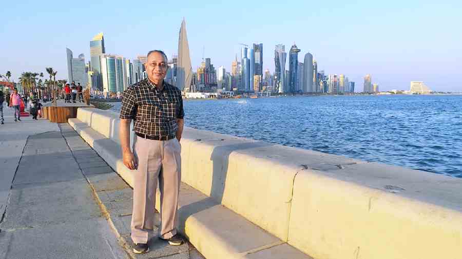  Arup Sen on Al Corniche Street. The white building on the extreme right behind him is the Sheraton Grand Doha hotel, which was the only building here in the 1990s, he said. Now, the skyline is dotted with tall towers.