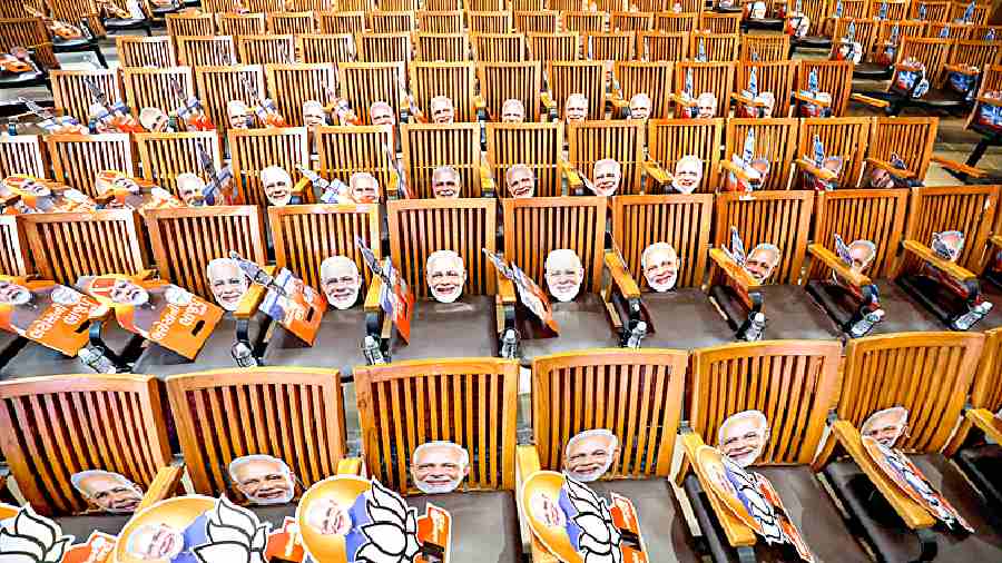 Modi masks on chairs during the release of the BJP manifesto in Gandhinagar on Saturday for the Gujarat Assembly elections. 