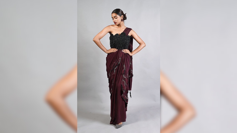 This crepe sari in wine with applique and thread details is great for a night of cocktails.