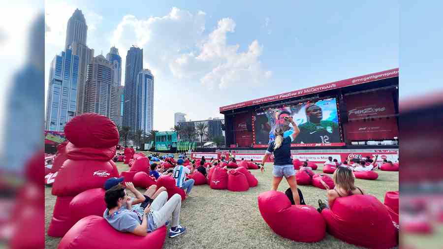 Fans watch the World Cup match between Argentina and Saudi Arabia last Tuesday on a giant screen in Dubai. 