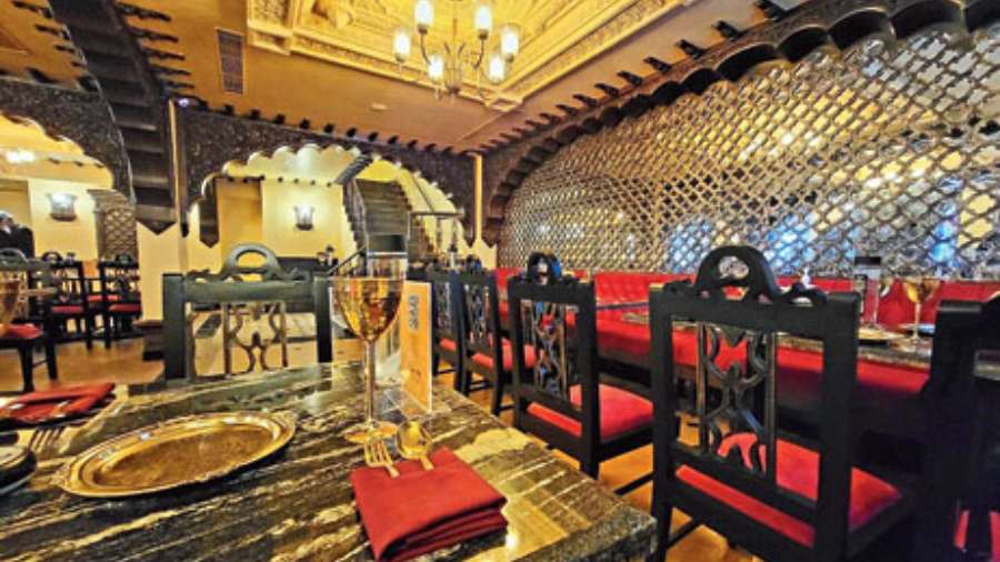 A glimpse of the Oudh 1590 outlet in Noida.The decor follows the same Mughal look and feel done in dark shades of black, brown and red with gold and silver accents. Spread over an area of over 4,500sq ft, the space can seat around 64 diners