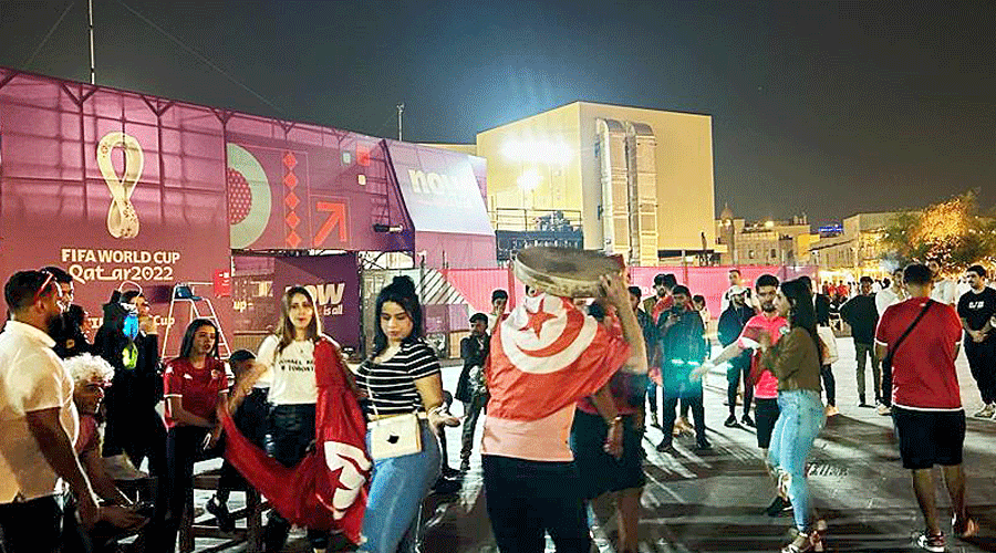 Tunisian fans dance at Souq Waqif in Doha.