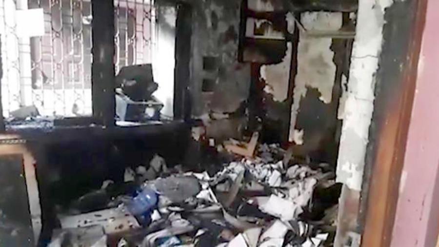 The damaged room on the ground floor where the computer that caused the fire was kept