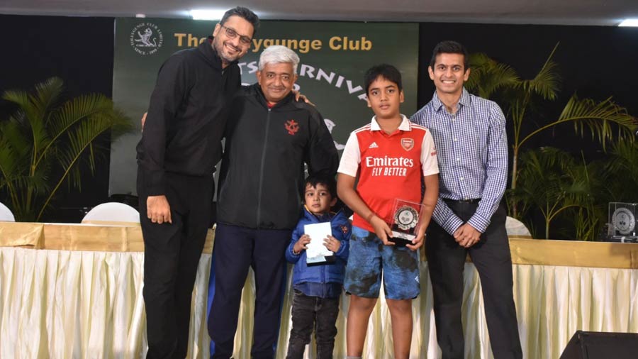 Raghu Damani (extreme left) and Agastya Mehta (in the Arsenal jersey) receive their trophies at Tollygunge Club