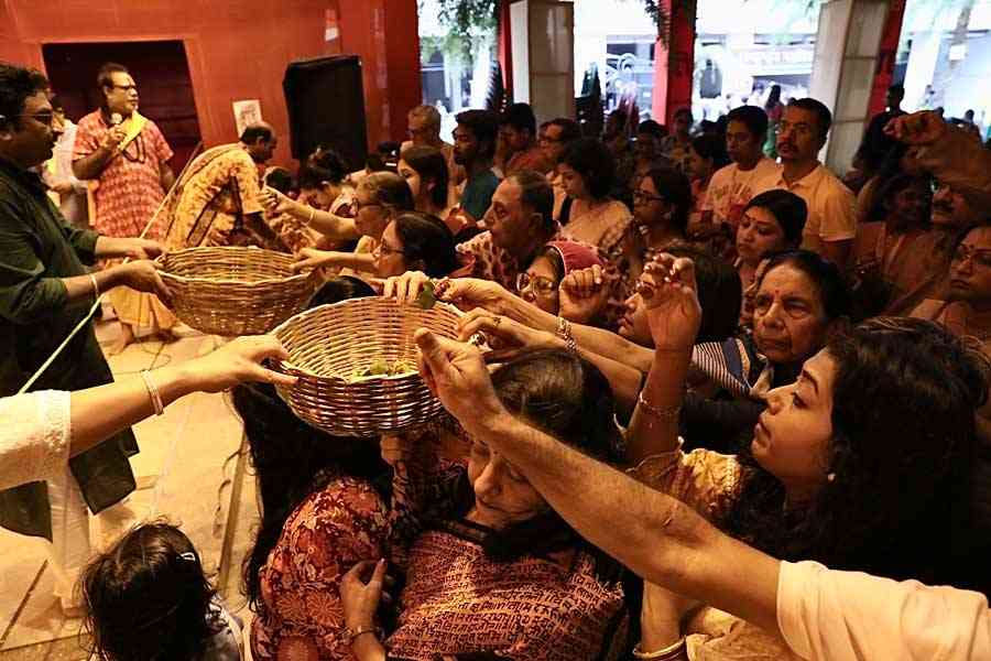 People offer ‘anjali’ at a puja on Saptami