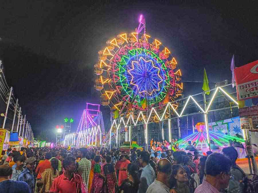 People of all age groups make a beeline at the Saradiya Mela at Sinthi More in North Kolkata on Tuesday.