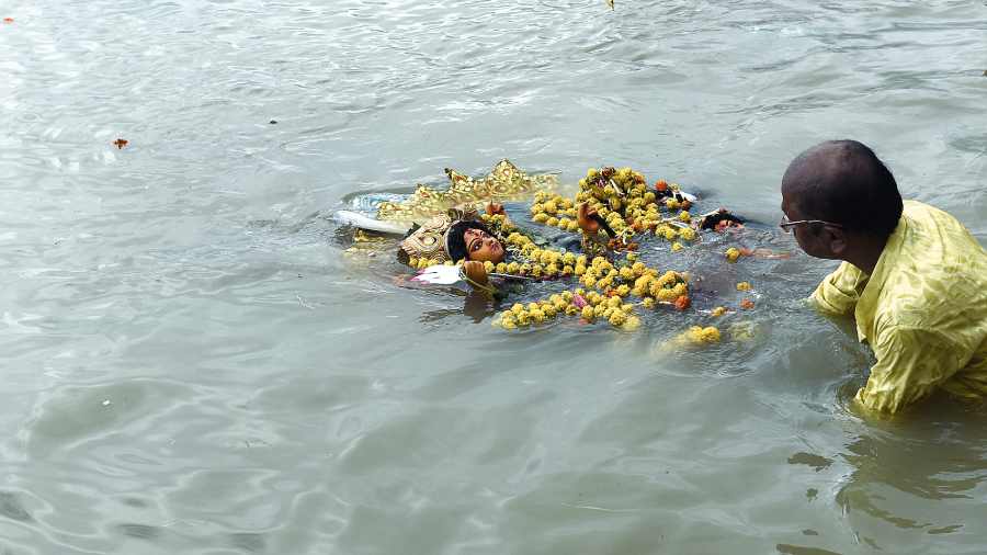 A Durga idol being immersed at Bichuli Ghat. 