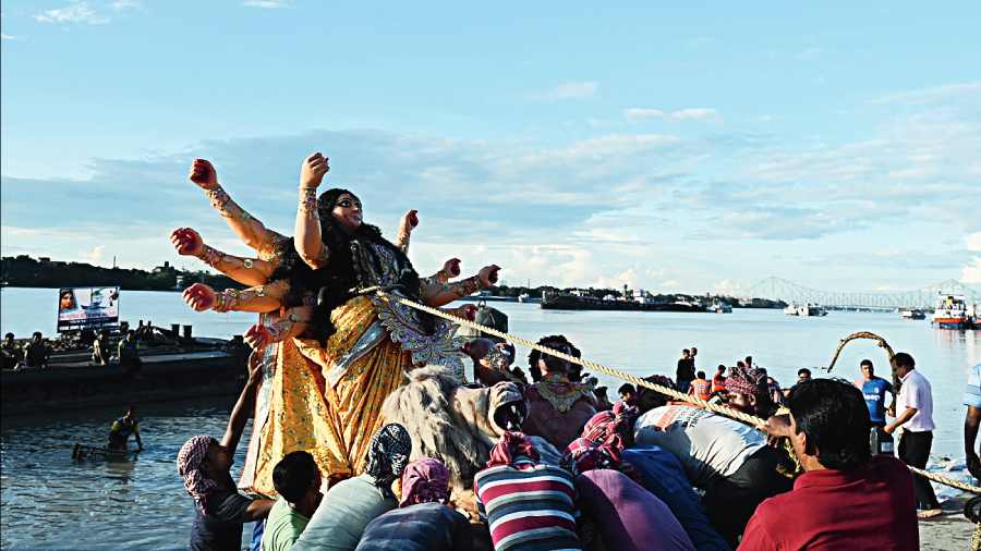 An idol being immersed at Babughat 