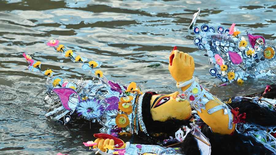 A Durga idol after it was immersed in the Hooghly at Babughat on Wednesday