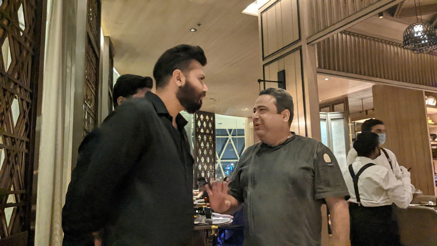 Chef Manish Mehrotra and (left) Culinary Culture CEO Raaj Sanghvi catch up before the Indian Accent pop-up at JW Marriott Kolkata on September 24. The Patna-born chef made rounds ensuring the guests were happy with the dishes that were rolling out. “The plate which goes out to the restaurant is important, but the plate which comes back into the kitchen is even more important,” grinned Manish
