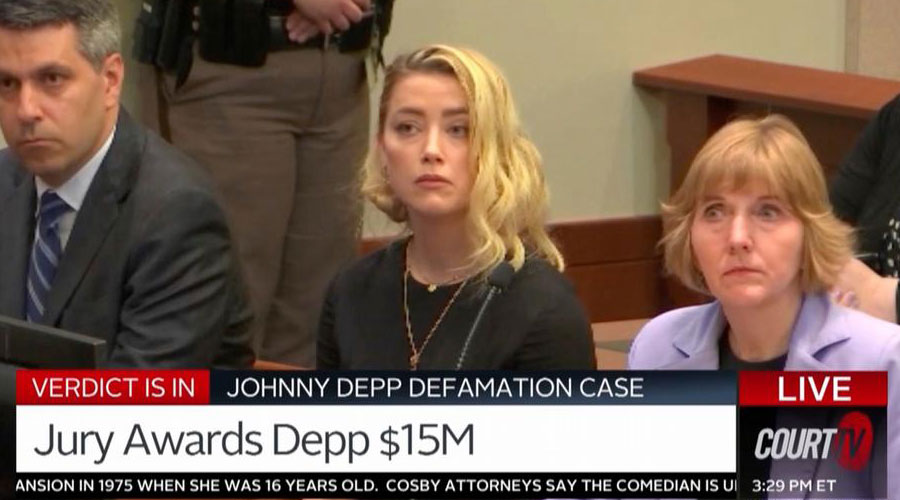 Amber Heard (center) was ordered to pay $15 million in damages to her ex-husband Johnny Depp