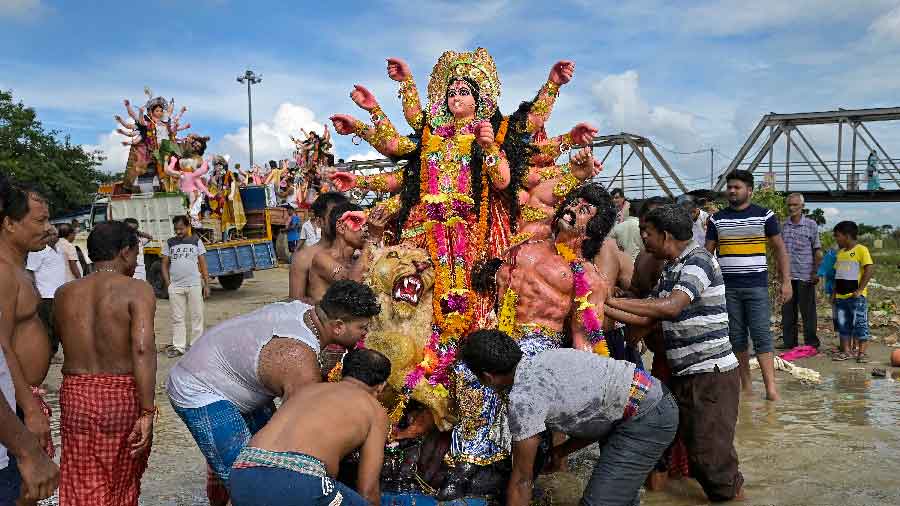 Devotees immerse an idol of Goddess Durga in Nadia, West Bengal