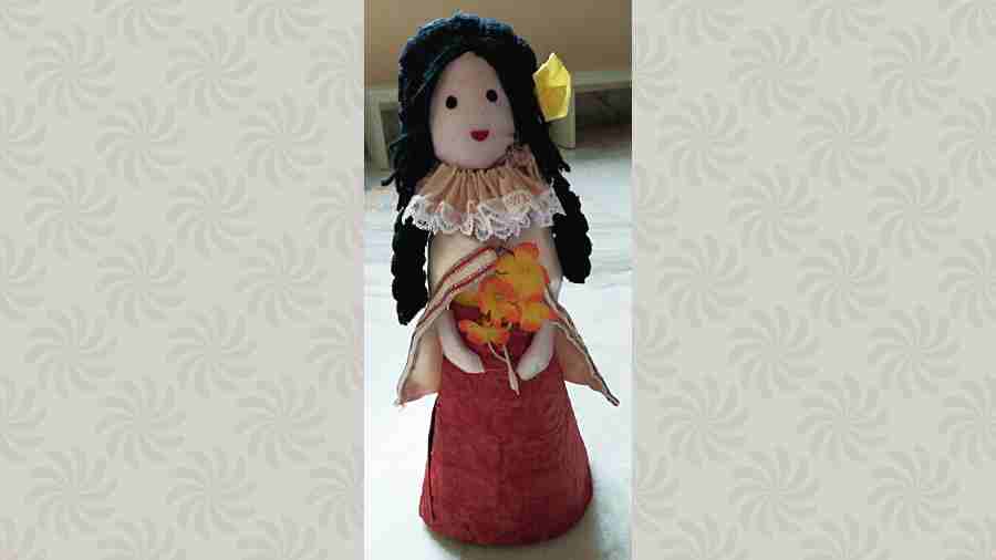 A doll made of bottle and cloth