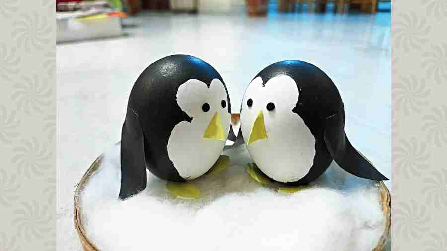 Penguins painted on eggshells
