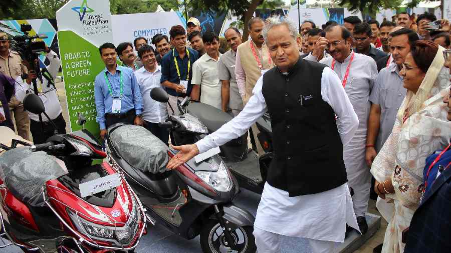  Gehlot shows electric scooters on display. 