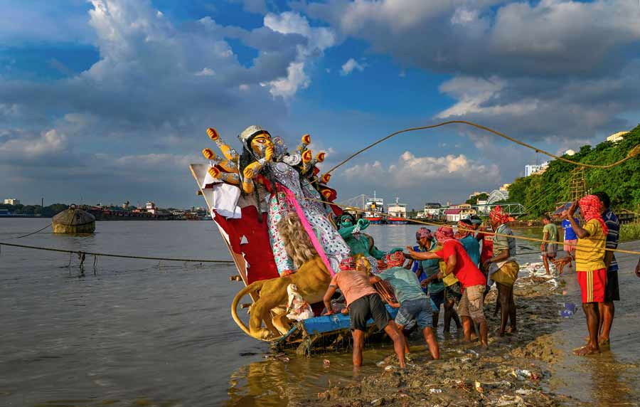 An idol of goddess Durga is being immersed on Friday