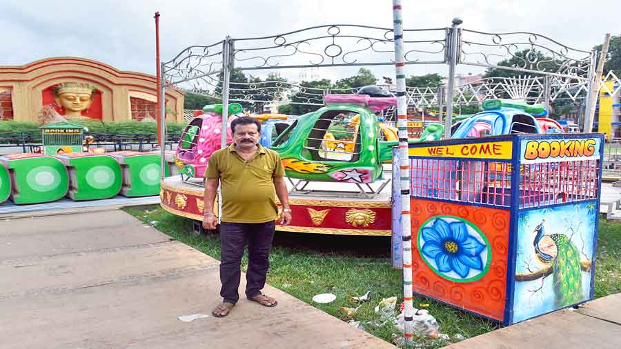 Ashok Ghosh, from Chandrakona, Paschim Medinipur, who brought a Ferris wheel and other rides to the fair at the FD Block Durga Puja ground in Salt Lake. 