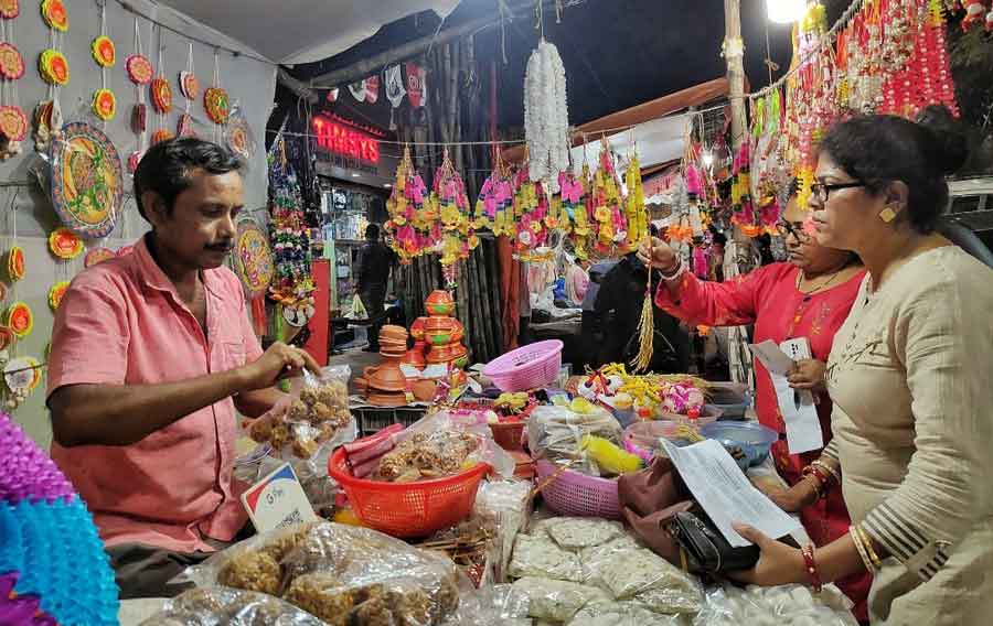Devotees shop for Lakshmi Puja essentials at Lake Market on Friday