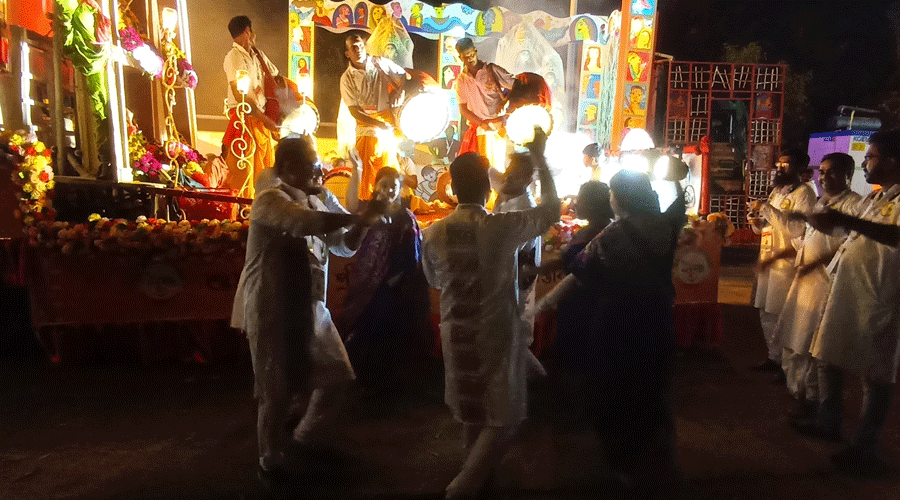 Ballygunge 21 Pally members dance during the Durga Puja carnival.