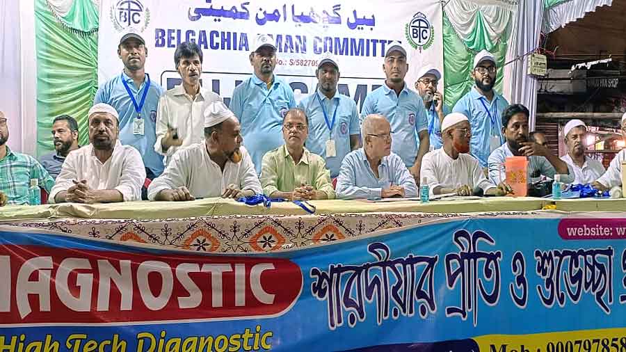 Members of the Belgachhia Aman Committee at the camp at the Belgachhia Tram Depot crossing during Durga Puja.