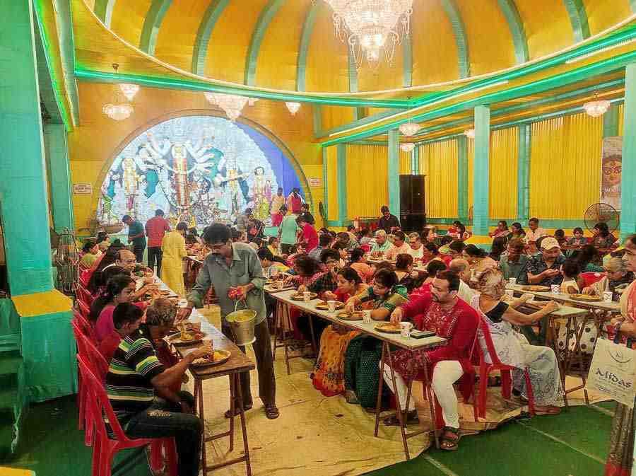 Ashtami ‘bhog’ being served for lunch at Sports Council Sarbojanin, Baguiati, on October 3, Monday