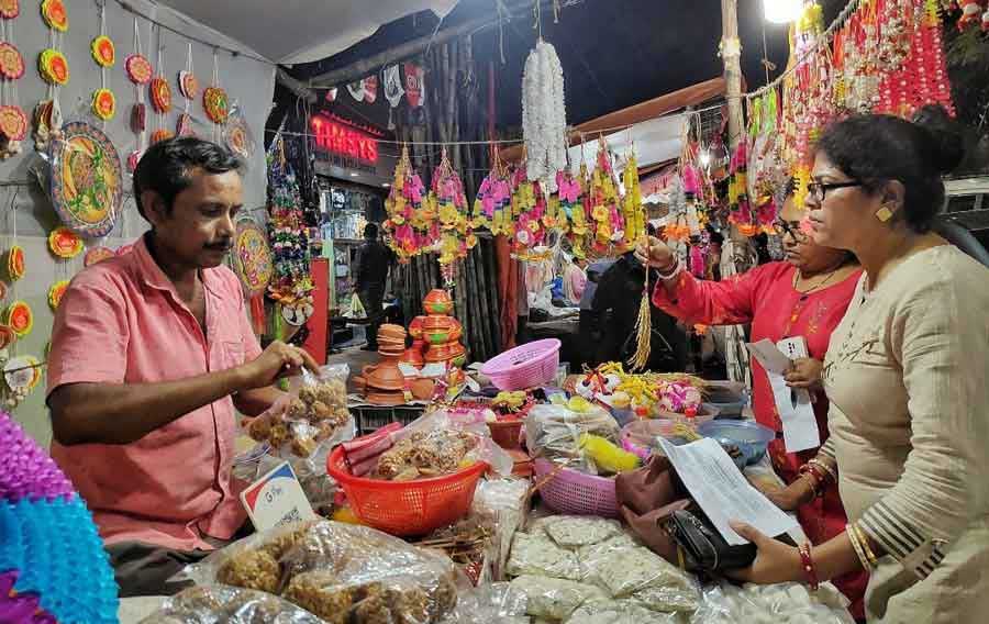 Devotees shop for Lakshmi Puja essentials at Lake Market on Friday, October 8