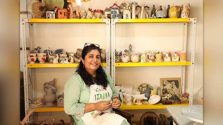 Shukti at her home studio, in front of her creations
