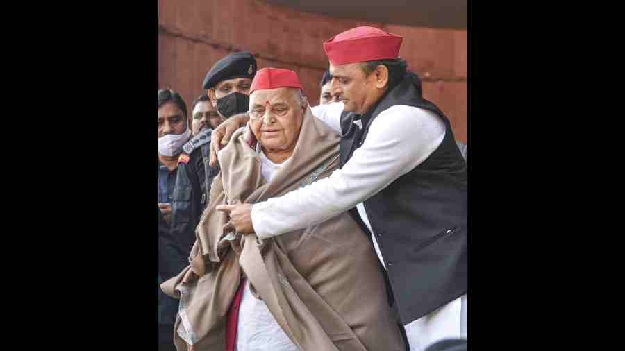 Samajwadi Party President Akhilesh Yadav felicitates party's founder Mulayam Singh Yadav on the latter's birthday, at party office in Lucknow on November 22, 2021. 