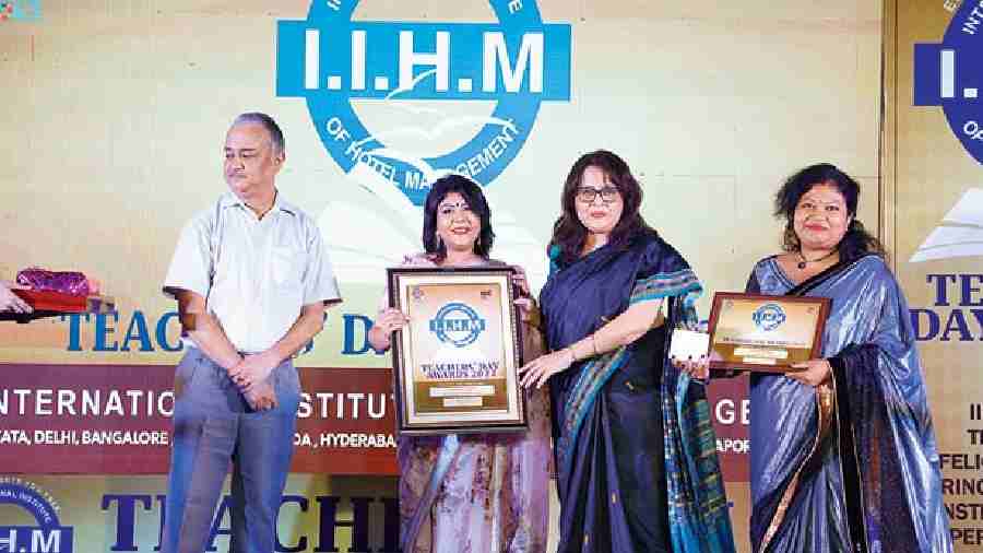 Patrali Manna, administration and accounts officer at Calcutta Public School Bidhan Park, was awarded along with principal Protichi Lahiri (second fromleft)