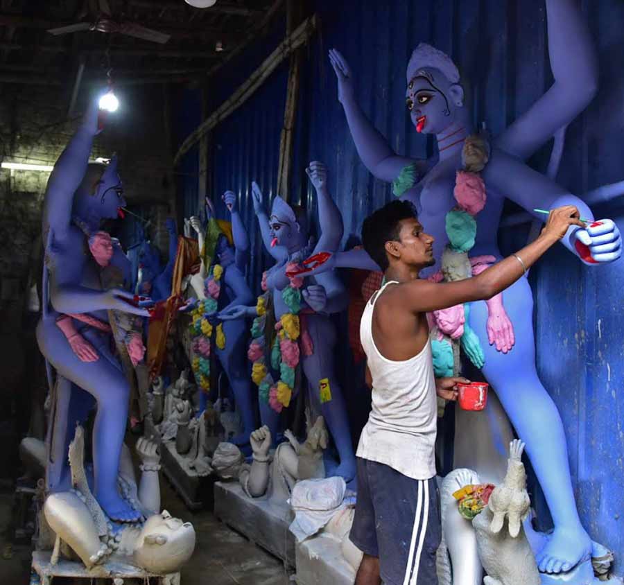 An artist paints a clay idol of Goddess Kali at Kumartuli on Wednesday. The festival of lights is the next big ticket celebration on the Bengali calendar