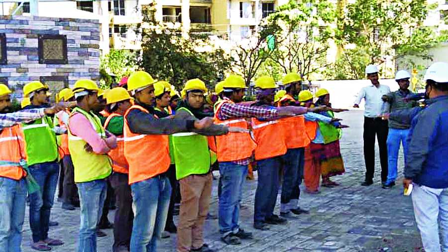 A group of migrant workers from Cooch Behar district at a construction site in Gurgaon.
