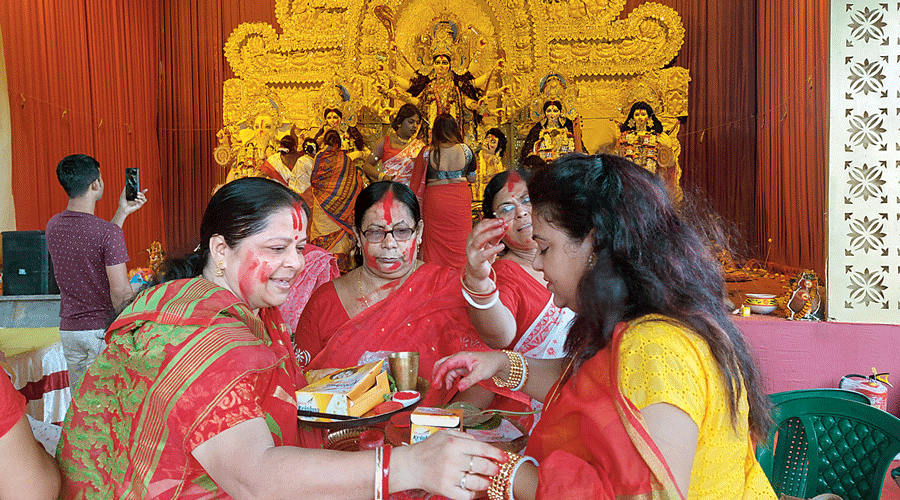 Women participate in sindoor khela at AE Block, New Town