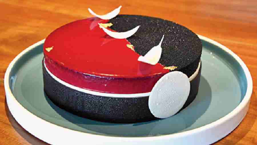 Milk Chocolate with Raspberry Entremet: Raspberry jam, vanilla custard, and milk chocolate and raspberry mousse create this creamy dessert that has the base of a Sacher torte.