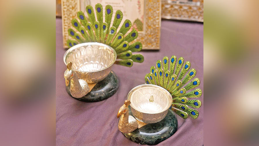 This silver bowl in peacock design from Baroque Fine Silver will make for a beautiful wedding gift. With nakshi and meenakari work on a stone base, it can be used as a tea light-holder or for puja purposes. Rs 6,500 and above.