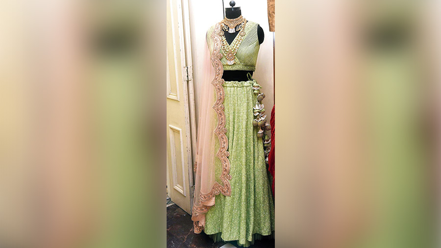 This mint-green mirror- embroidered lehnga from  Allure comes with a peach-coloured net dupatta with zardozi hand-embroidery and is perfect for a Sangeet ceremony or any pre or post wedding ritual in your family.