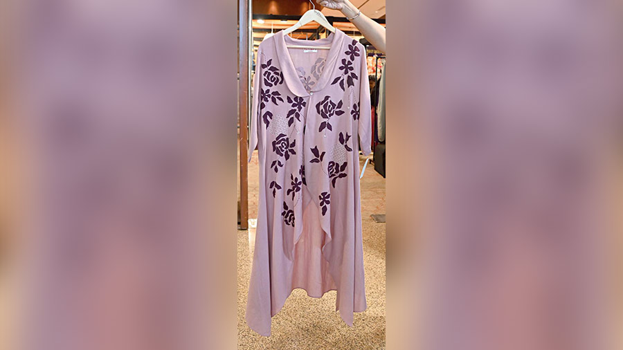 From Amrisha Design, this modish piece in onion pink with interesting embroidery work on linen stood out. Team it up with a camisole or straight pant and be a stunner