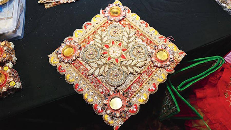 Nimantran by Sangeeta Goenka from Guwahati displayed Diwali home decor pieces like this Rangoli Diya holder
