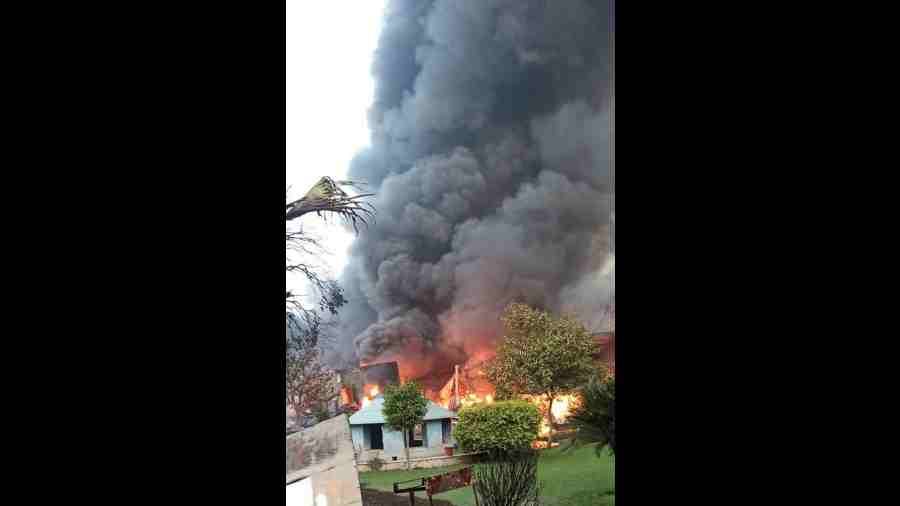 Smoke billows after a fire broke out at an auto parts manufacturing company, at Bilaspur Industrial area in Gurugram
