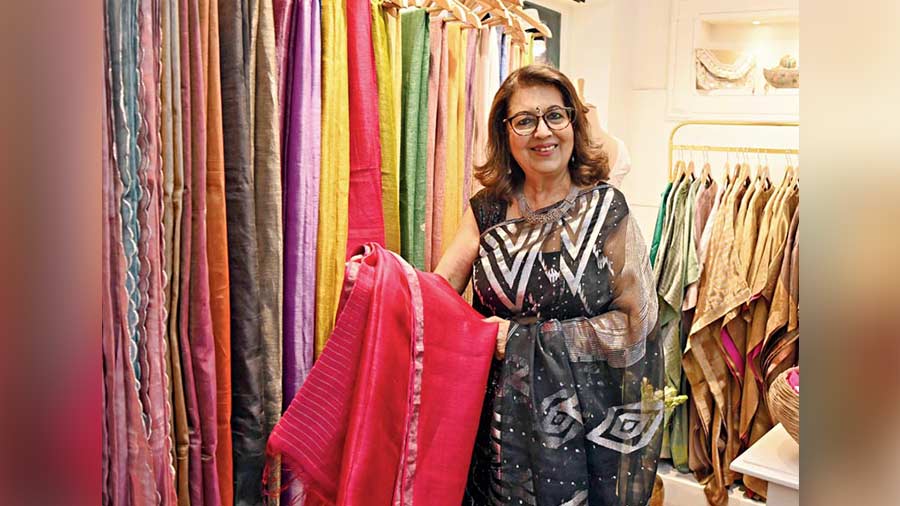 Communication pro and columnist Rita Bhimani checks out a gorgeous fuchsia pink sari at the store.