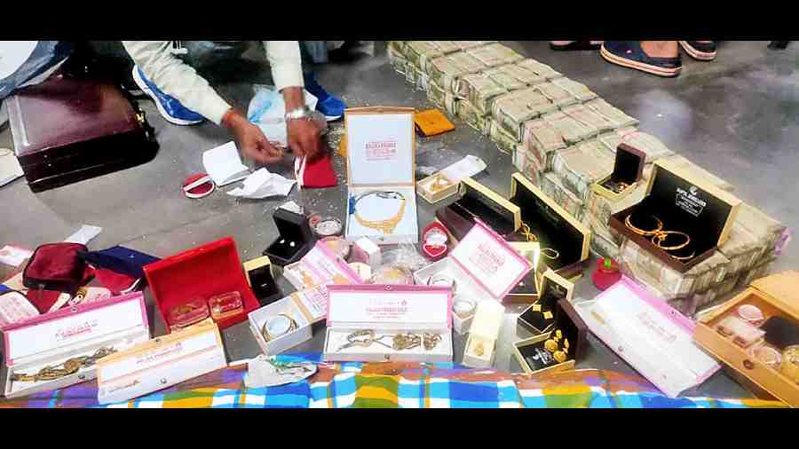 The cash and jewellery seized on Sunday