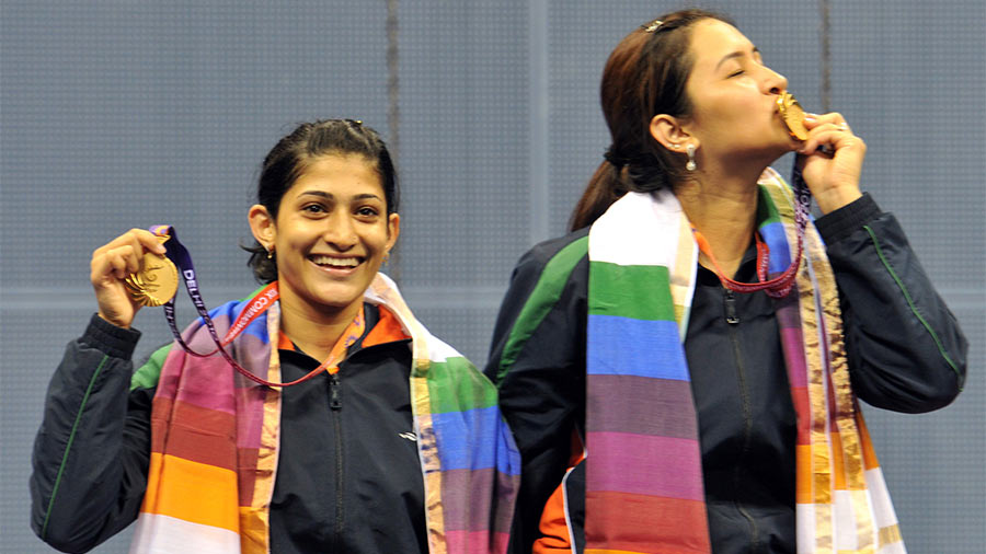 Ashwini and Jwala with their gold medals at the 2010 Commonwealth Games