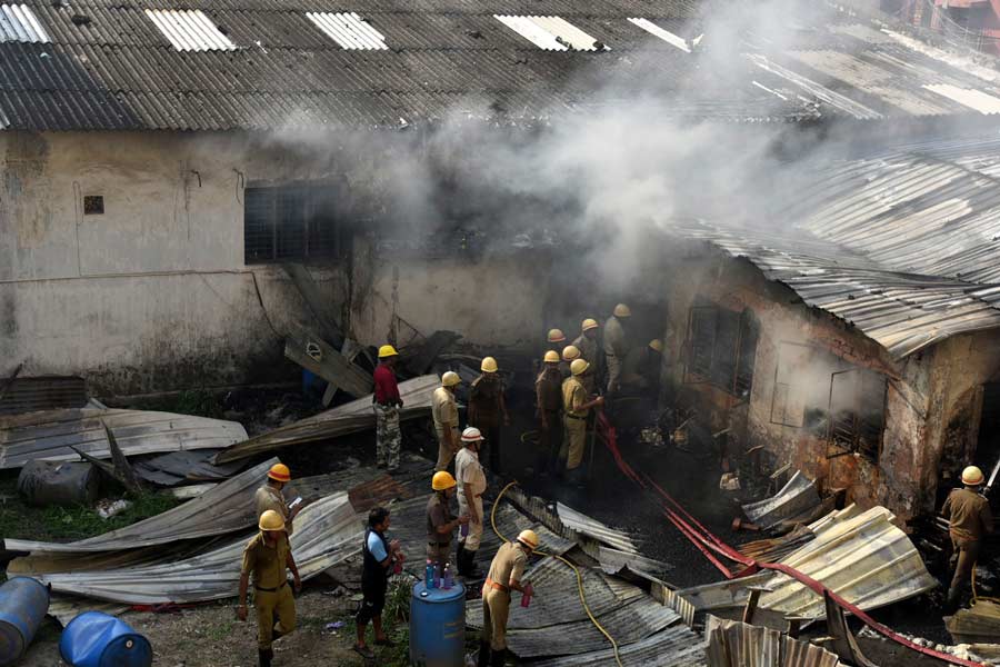 Firefighters try to douse a flame at a leather godown in Topsia on Tuesday