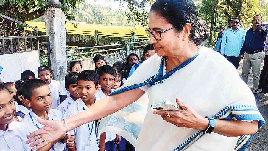 Mamata Banerjee with children in Malbazar on Tuesday. 